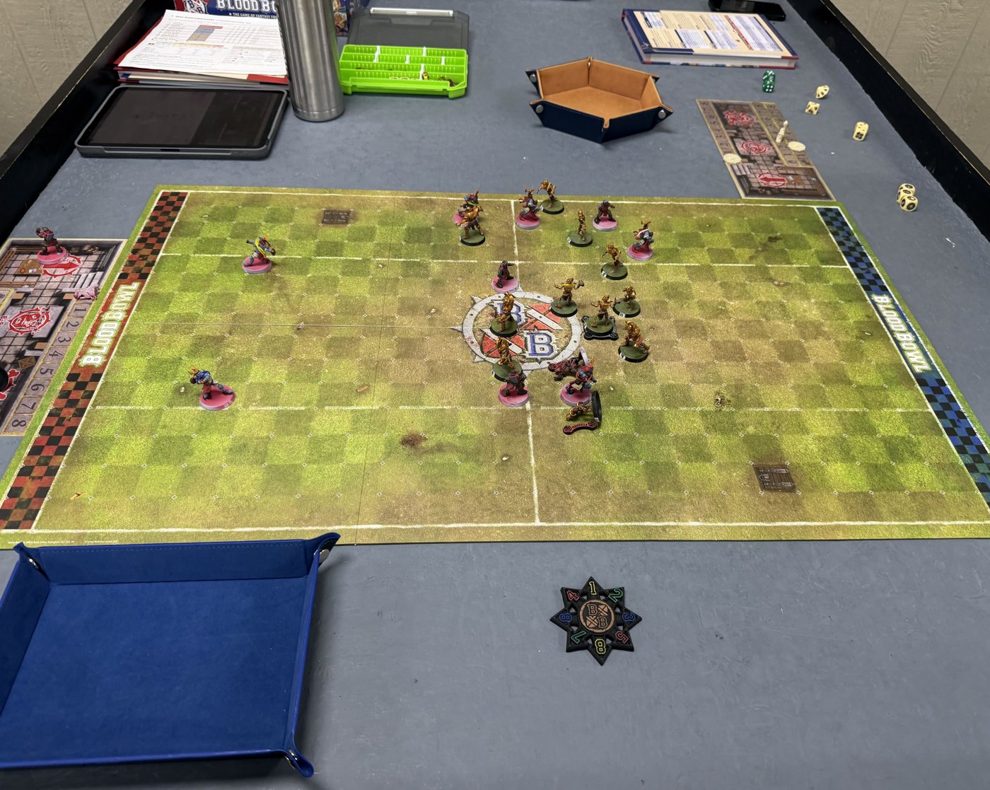 The whole pitch mid-match, the Tomb Kings wall in the middle and two Grenadiers out wide