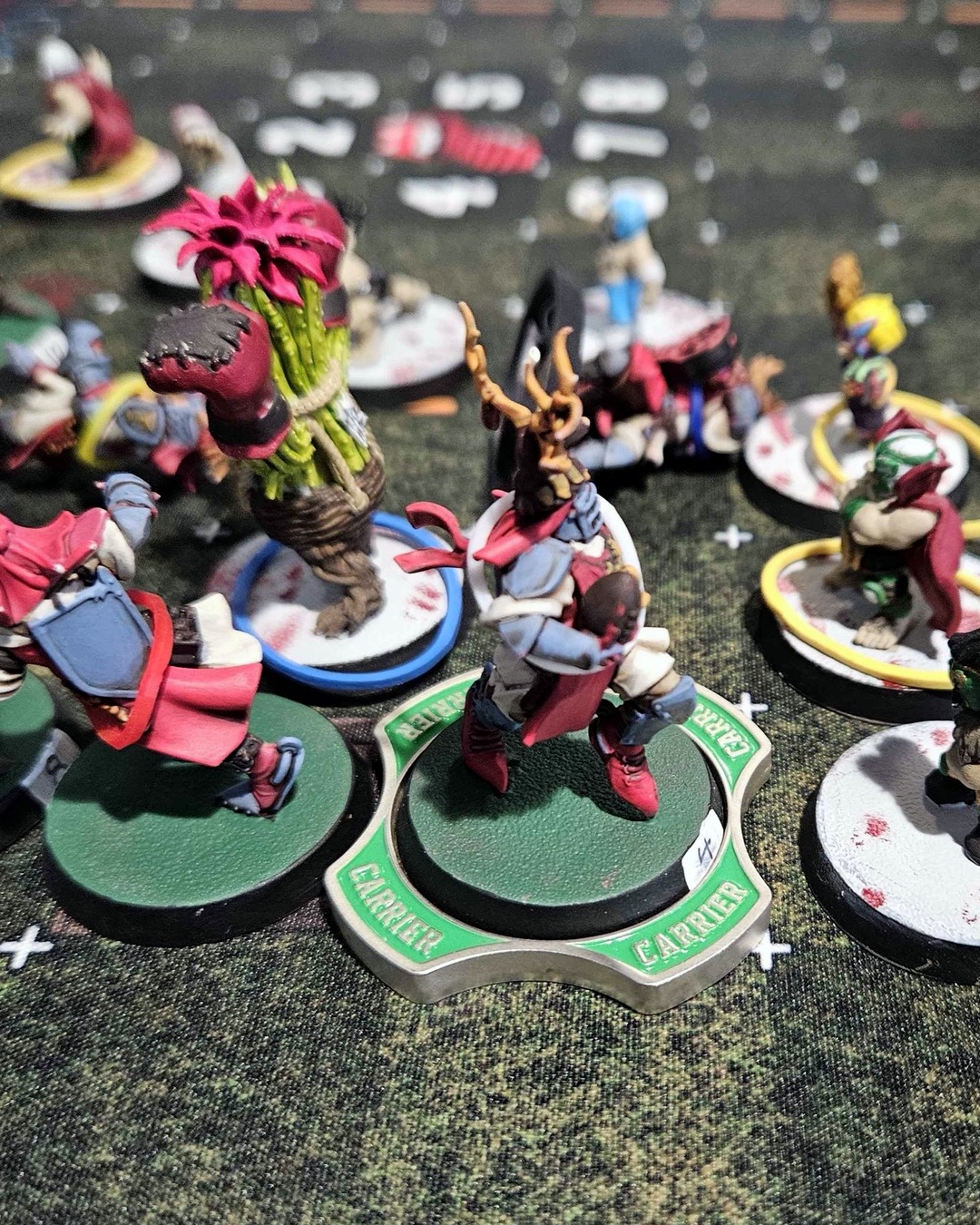 An antler-crested knight on the Carrier marker beside the halfling Treeman