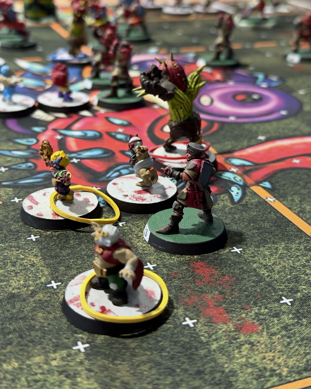The Treeman Locustthorn looming over a Grenadier squire, a caped luchador halfling in front