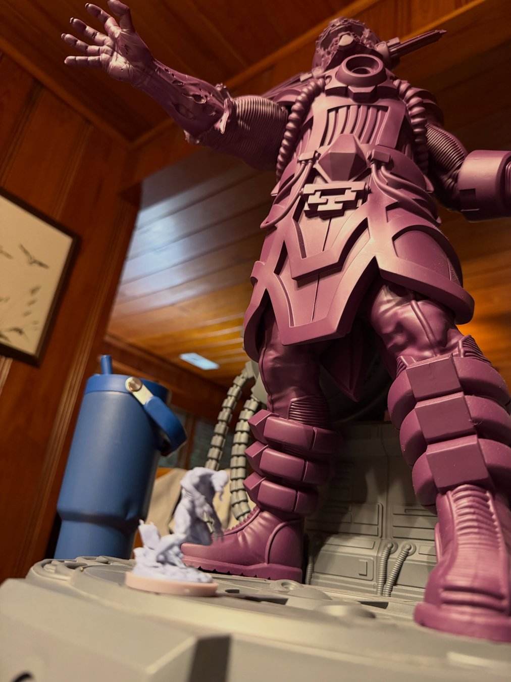Giant unpainted Galactus towering over the Marvel United board