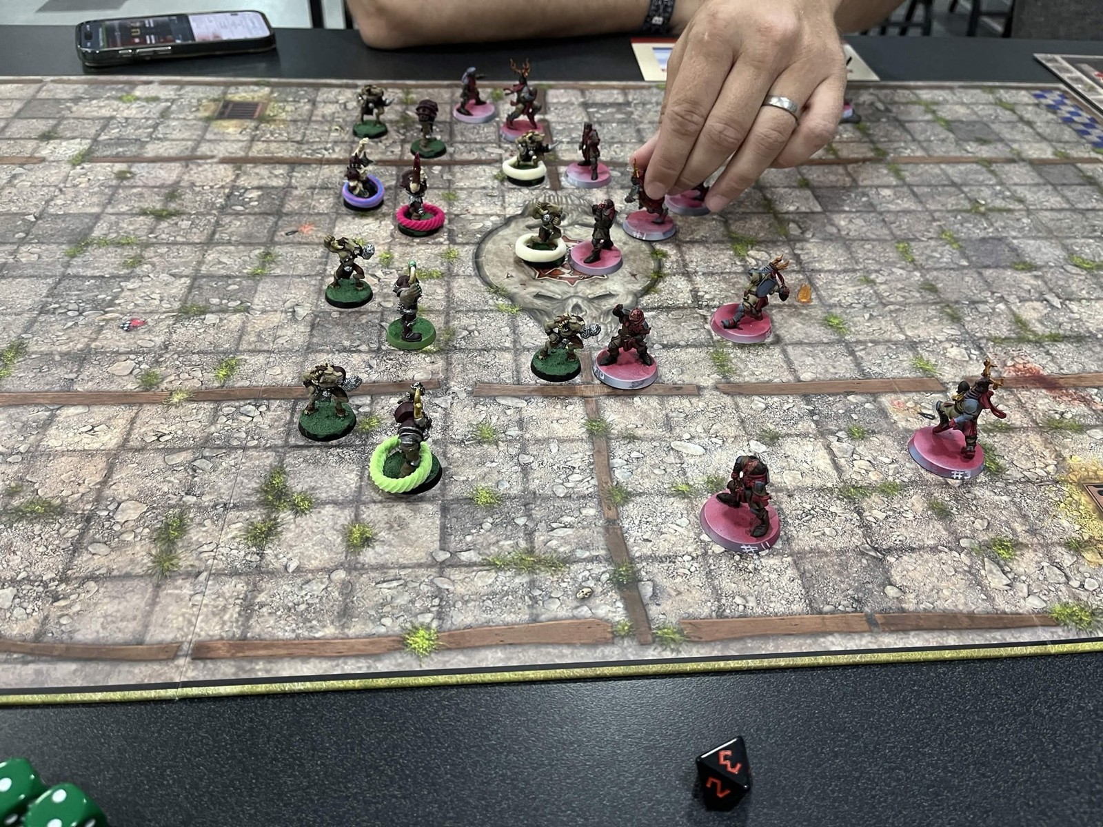 The pitch mid-drive as a player moves a Chaos Chosen piece into the Grenadiers' lines