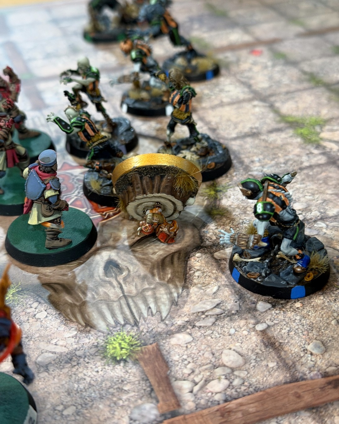 Akhorne the Squirrel on his tree-stump base staring down a line of Ghouls and Zombies, a Grenadier squire beside him
