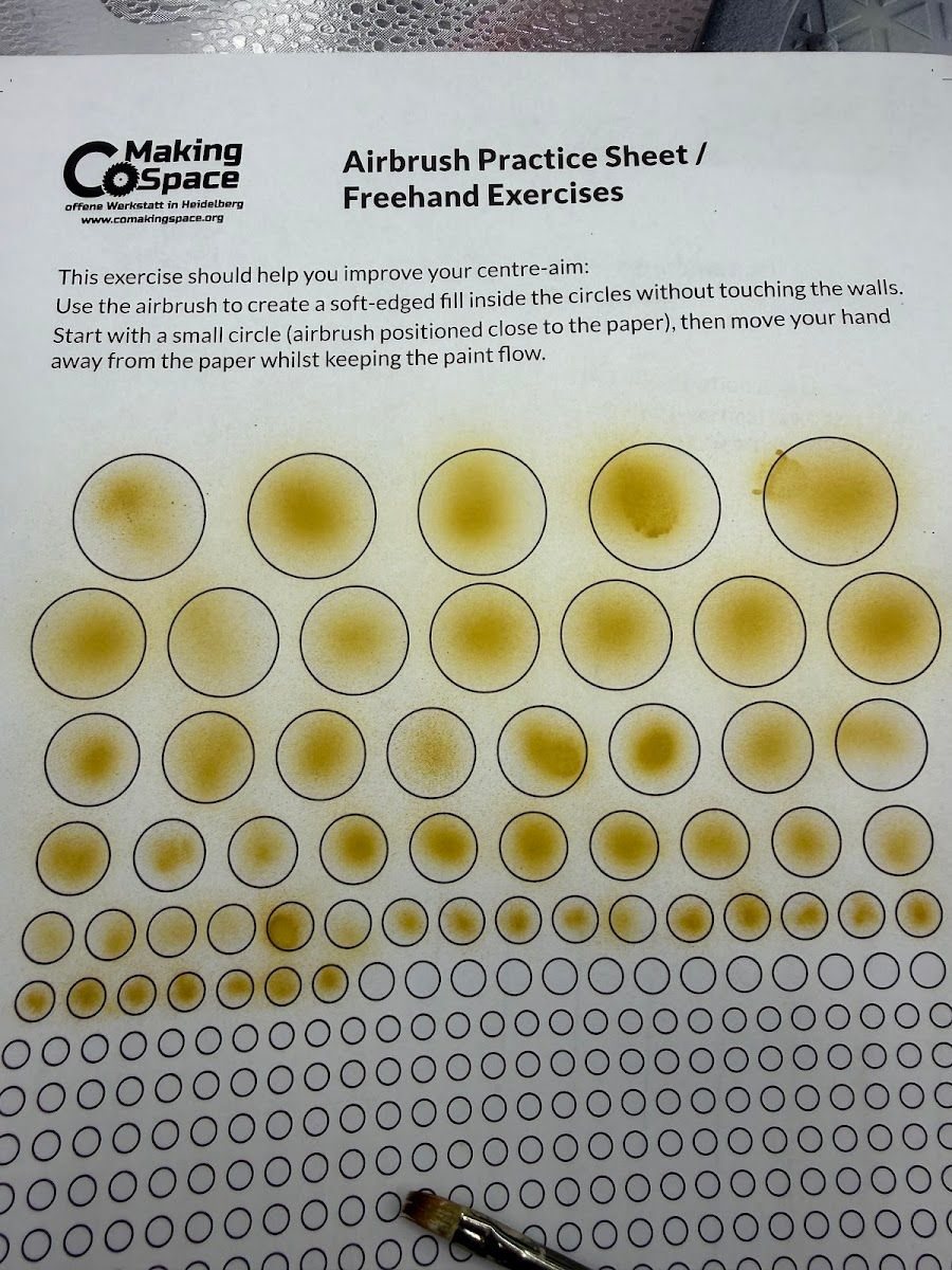A printed airbrush practice sheet with rows of circles