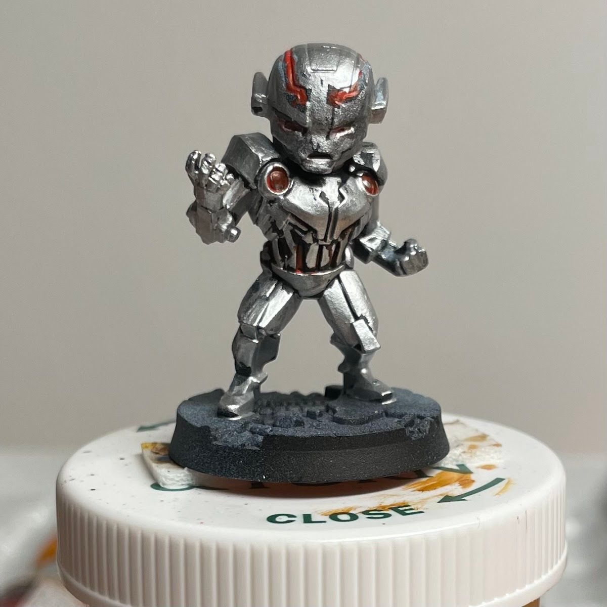 Early Ultron mini sitting on a pill bottle used as a painting handle